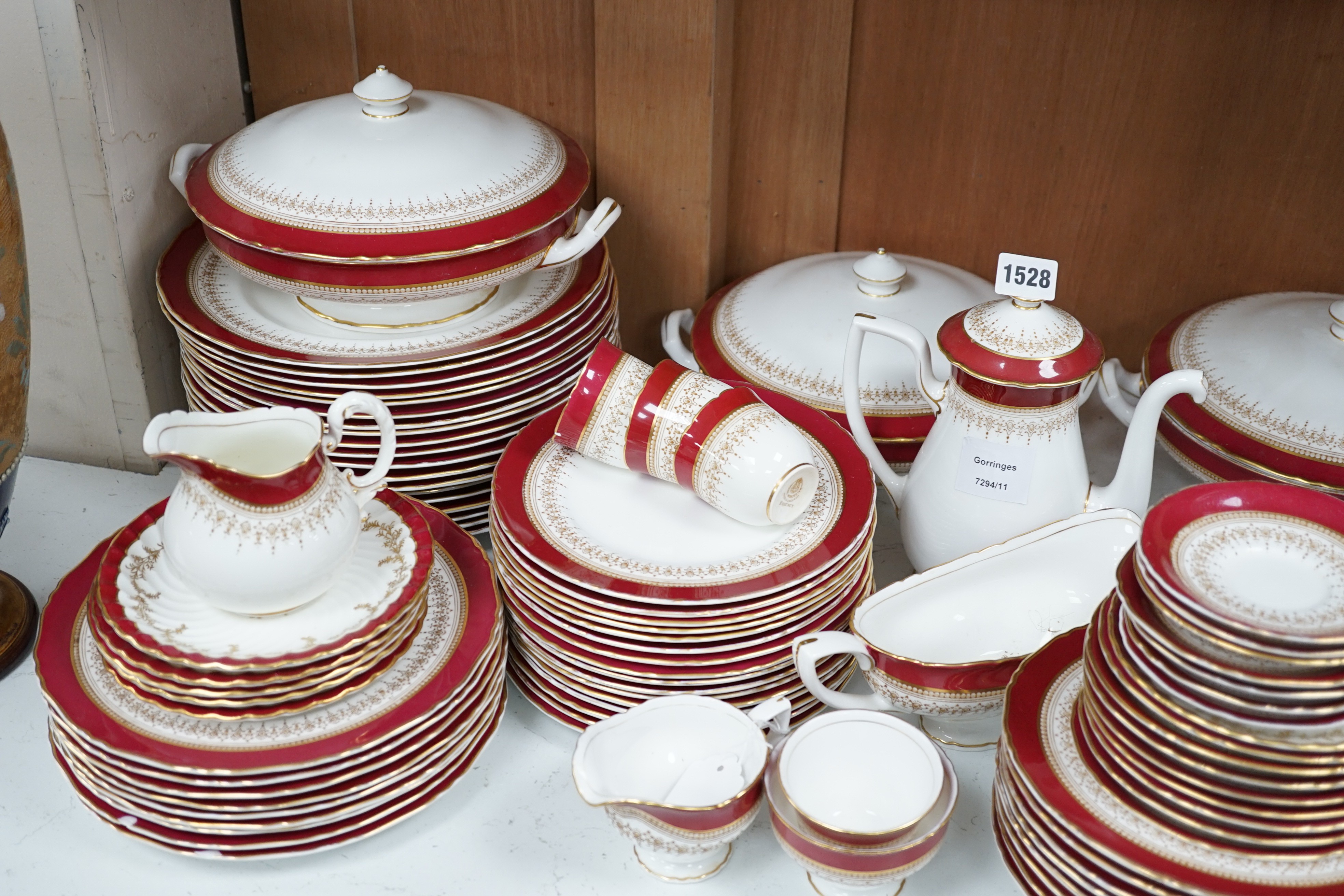 A Royal Worcester Regency pattern red and gilt bordered part dinner service